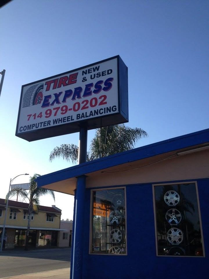 Tire Express sign and blue storefront in Santa Ana